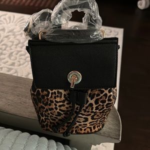Selling brand new small leopard back pack, never even used.